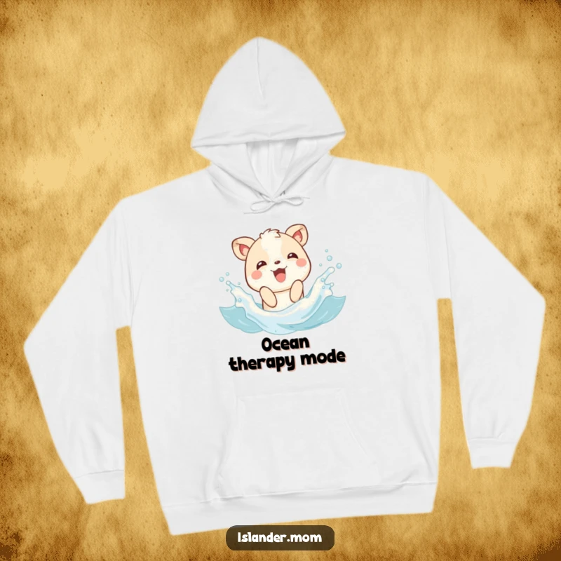 Funny hoodie featuring an animal character joyfully splashing in gentle waves, offering cozy comfort and happy beach vibes.