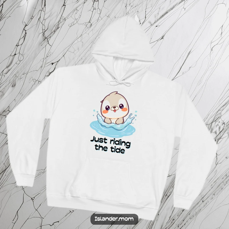 Funny hoodie showcasing a cute kawaii islander animal joyfully splashing in gentle, sparkling ocean waves.